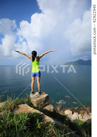 Woman enjoying nature with her opened arms   42922940