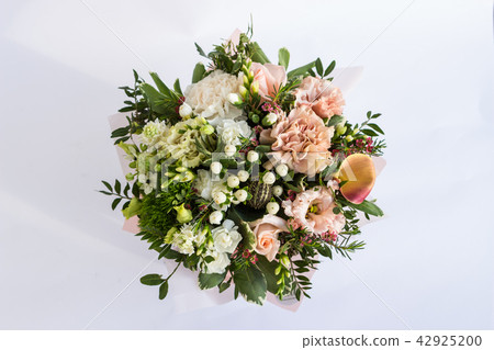 Flat lay of a beautiful florish bouquet composition on the white background Flat lay of a beautiful florish bouquet composition on the white background 42925200