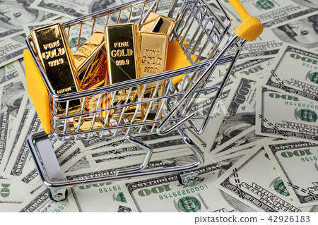 Gold bars in shopping  trolley 42926183