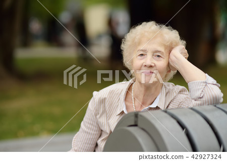 beautiful senior woman with curly white hair beautiful senior woman with curly white hair 42927324