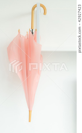 umbrella keep on shelf and white wall umbrella keep on shelf and white wall 42927423