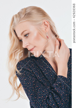 cropped photo: girl holding her hand near her face 42928368