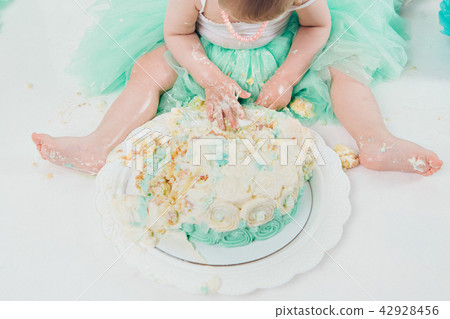 leg of baby food on white background.Feet and cake 42928456