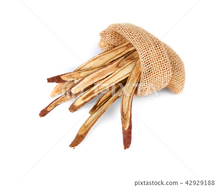 dried Liquorice roots on a white background. dried Liquorice roots on a white background. 42929188
