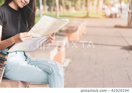 Traveler woman planing on map for travelling. Traveler woman planing on map for travelling. 42929194