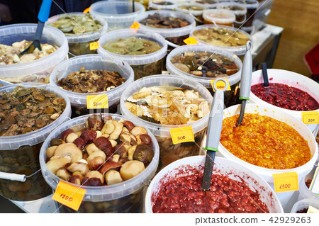Salted mushrooms and jams on market Salted mushrooms and jams on market 42929263