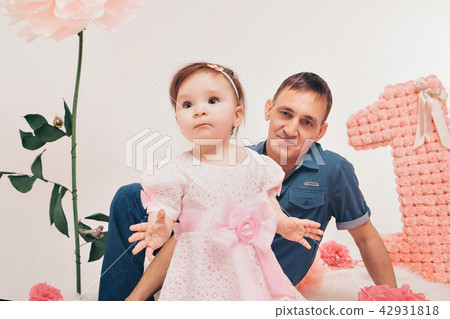 man and a child sitting on the floor man and a child sitting on the floor 42931818