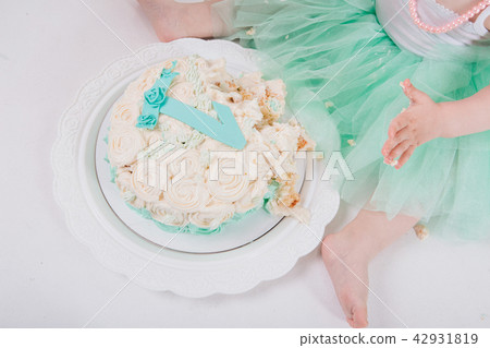 leg of baby food on white background.Feet and cake 42931819