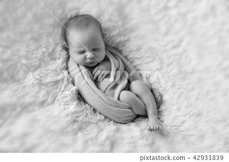 A little child in adiaper lies and sleeping A little child in adiaper lies and sleeping 42931839