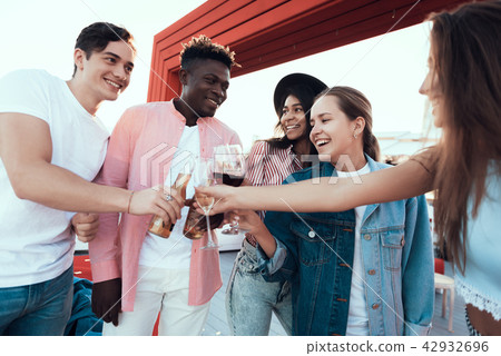 Cheerful ladies and males tasting alcohol 42932696