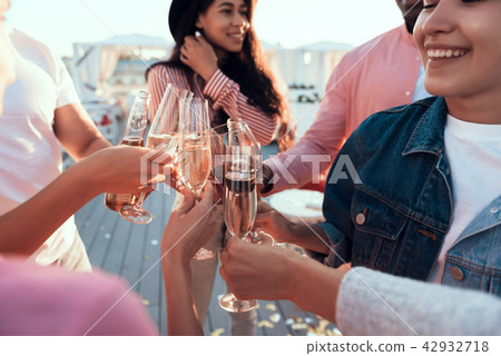 Happy females and men drinking alcohol Happy females and men drinking alcohol 42932718