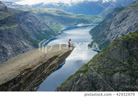 Yog is praying on the edge Trolltunga. Norway Yog is praying on the edge Trolltunga. Norway 42932979