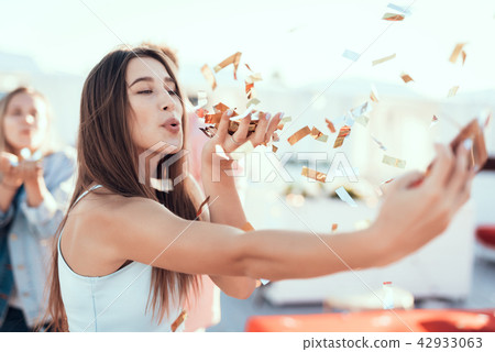 Cheerful girl having fun with appliance Cheerful girl having fun with appliance 42933063
