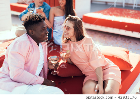 Smiling girl and male tasting delicious beverage Smiling girl and male tasting delicious beverage 42933176