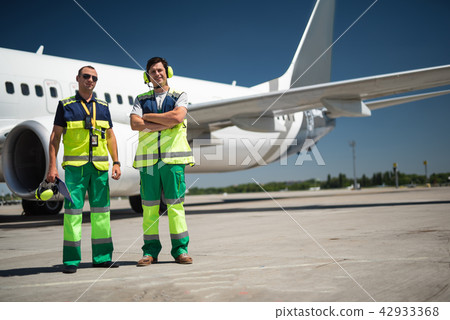 Cheerful workers at airport Cheerful workers at airport 42933368