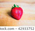 Strawberry on a wooden board 42933752
