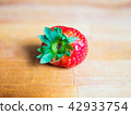 Strawberry on a wooden board 42933754