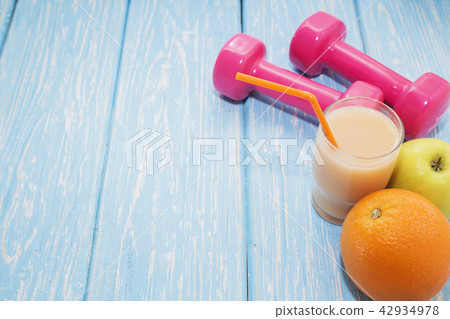 concept preparing to fitness sports equipment top view. The concept of a healthy diet. Small concept preparing to fitness sports equipment top view. The concept of a healthy diet. Small 42934978