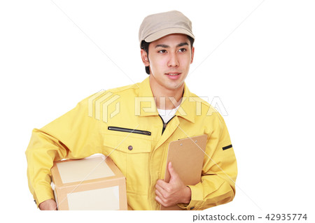 A man with a smile carrying baggage A man with a smile carrying baggage 42935774