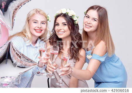 Three smiling woman having fun on party Three smiling woman having fun on party 42936016