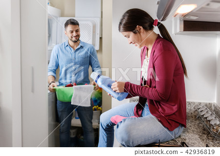 Man And Woman Doing Chores Washing Clothes Man And Woman Doing Chores Washing Clothes 42936819