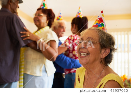 Senior Friends Dancing At Birthday Party In Hospice 42937020
