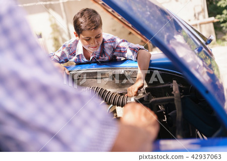 Old Man Grandpa Teaching Boy Fixing Car Engine 42937063
