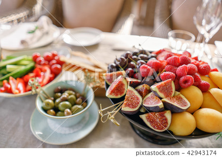 Different meals for the guests on Banquet table. delicious dishes on the table in the restaurant Different meals for the guests on Banquet table. delicious dishes on the table in the restaurant 42943174