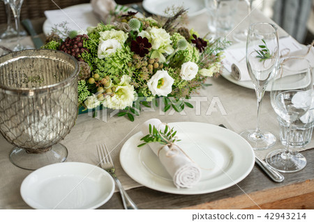 Wedding Banquet or gala dinner. The chairs and table for guests, served with cutlery and crockery 42943214