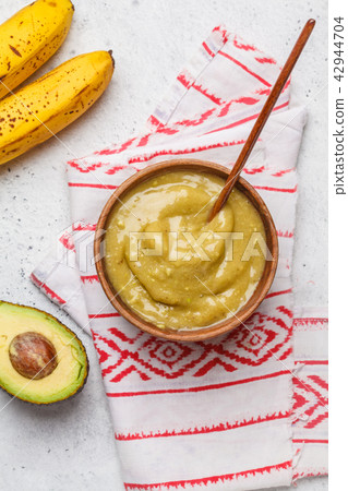 Green vegan banana avocado ice cream in a wooden 42944704