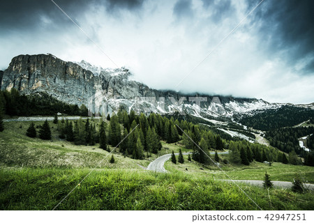 Gardena pass in Italian Alps at dramatic cloudy Gardena pass in Italian Alps at dramatic cloudy 42947251