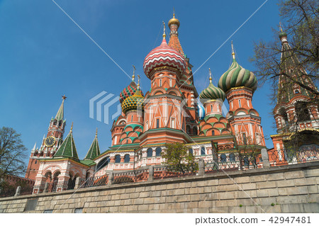 Red square. St. Basil's Cathedral on the background of the Kremlin Spasskaya tower. Red square. St. Basil's Cathedral on the background of the Kremlin Spasskaya tower. 42947481