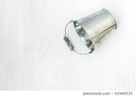 Empty metal bucket Empty metal bucket 42948535