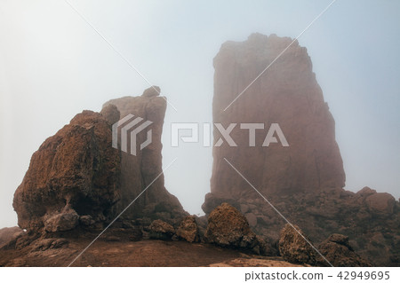 Roque Nublo big mountain with fog in Gran Canaria Roque Nublo big mountain with fog in Gran Canaria 42949695