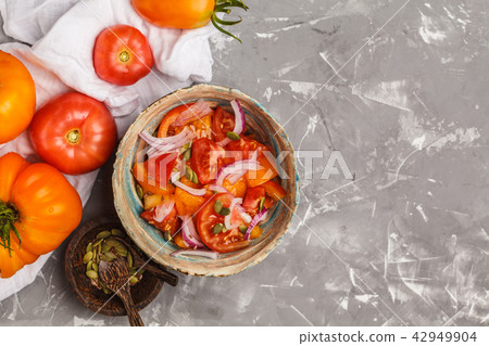 Tomato salad with onions. Healthy vegetarian food. Tomato salad with onions. Healthy vegetarian food. 42949904