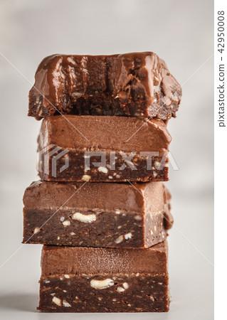 Stack of chocolate fudge bars on white background. Stack of chocolate fudge bars on white background. 42950008