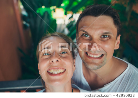 Portrait of a woman and a man: takes a selfie 42950928
