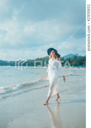 handsome girl in hat on the beach background handsome girl in hat on the beach background 42950931