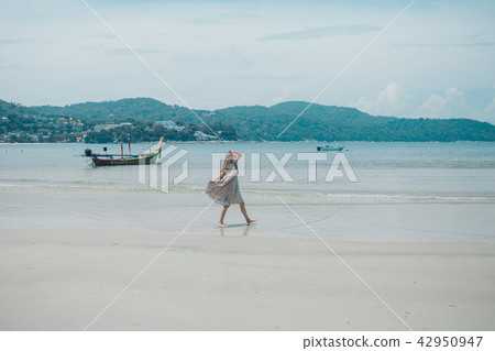 handsome girl on the beach background. handsome girl on the beach background. 42950947