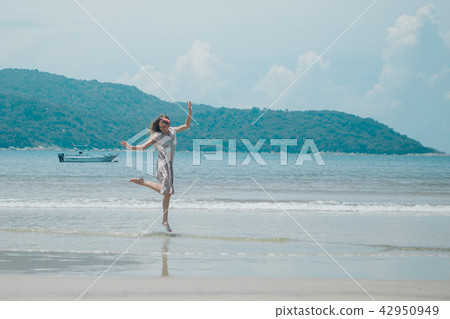 beautiful girl dancing on the beach. beautiful girl dancing on the beach. 42950949