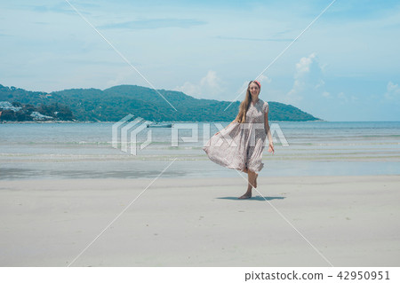beautiful girl dancing on the beach. beautiful girl dancing on the beach. 42950951