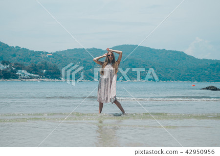 handsome girl on the beach background. handsome girl on the beach background. 42950956