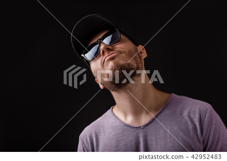 young bearded man in cap and sunglasses young bearded man in cap and sunglasses 42952483