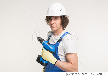 Portrait of handsome builder with skrewdriver on white background 42952853