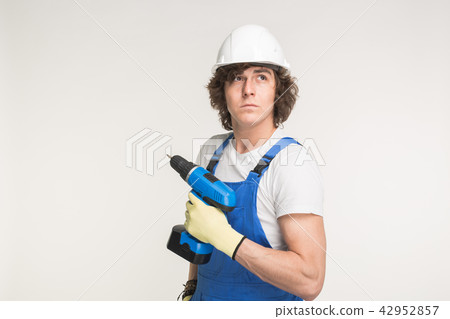 Portrait of handsome builder with skrewdriver on white background 42952857