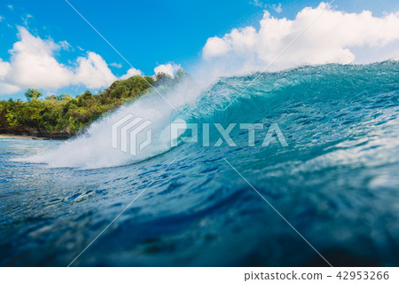 Blue barrel wave in ocean. Wave and sky in Bali Blue barrel wave in ocean. Wave and sky in Bali 42953266
