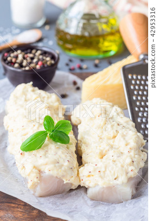 Preparation of cod fillet under cheese crust Preparation of cod fillet under cheese crust 42953316
