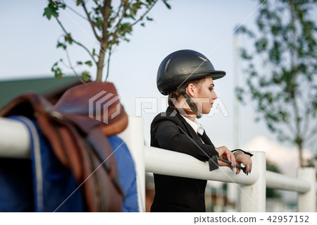 elegant rider woman in helmet with whip elegant rider woman in helmet with whip 42957152