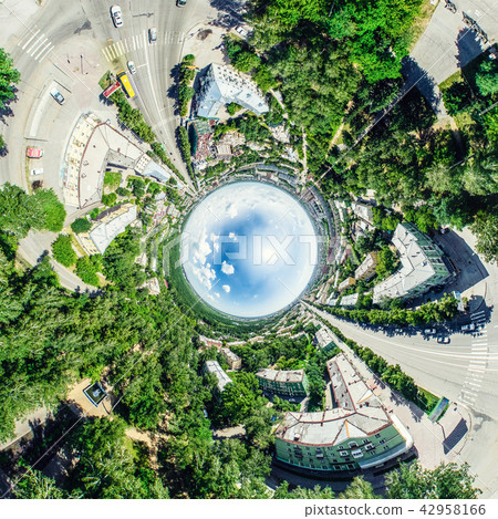 Aerial city view with crossroads and roads, houses, buildings, parks and parking lots. Sunny summer 42958166