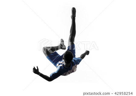 Professional football soccer player in action isolated on white background Professional football soccer player in action isolated on white background 42958254